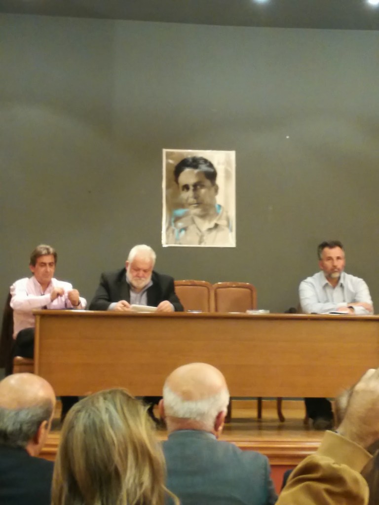 Sifis (Josef) Zachariadis under his father’s portrait